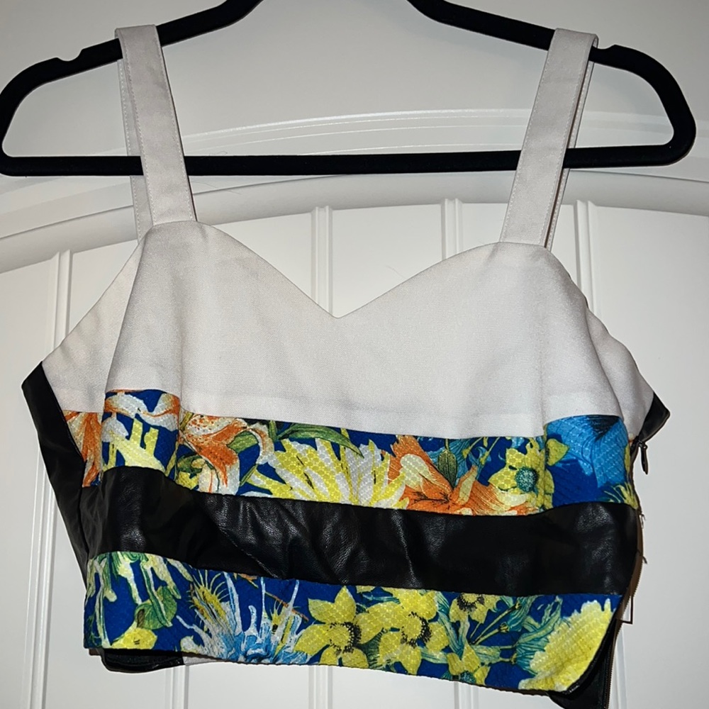 Crop top with faux leather and floral detailing. Only worn once